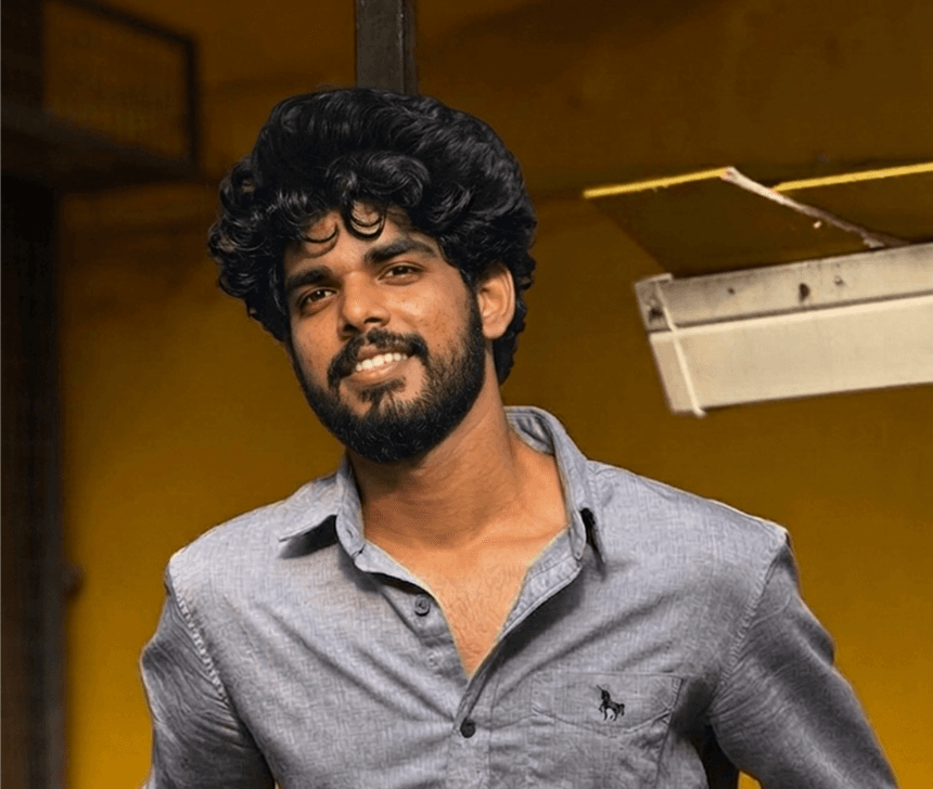 Vivek smiling in a portrait photo