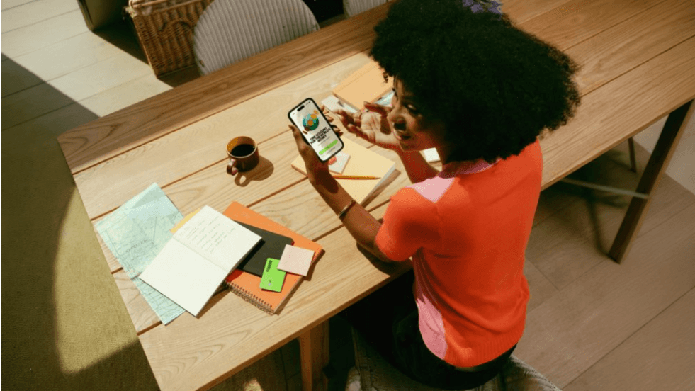 Person using a wellness or spa booking app at a desk