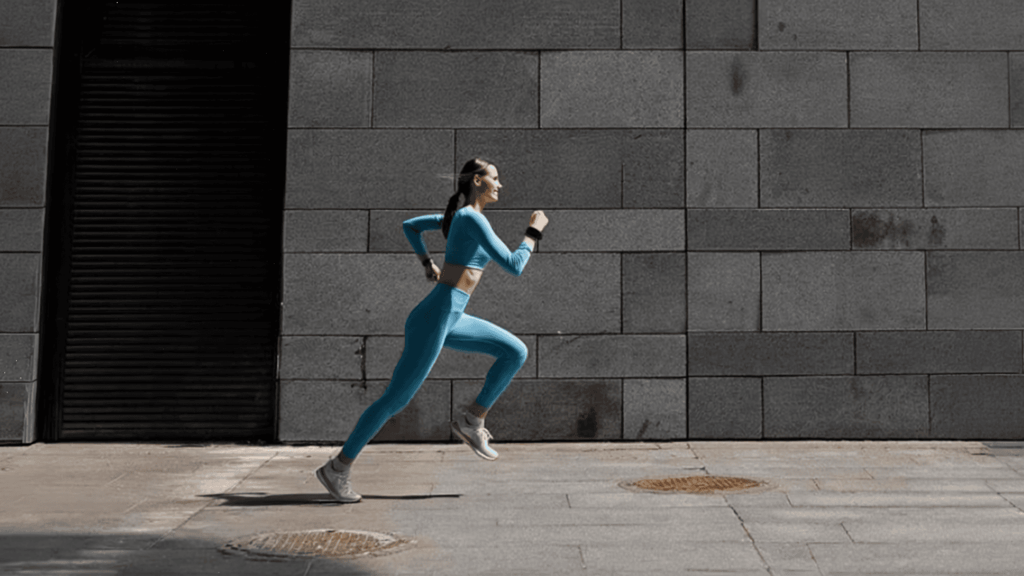 Runner wearing blue activewear in an urban environment